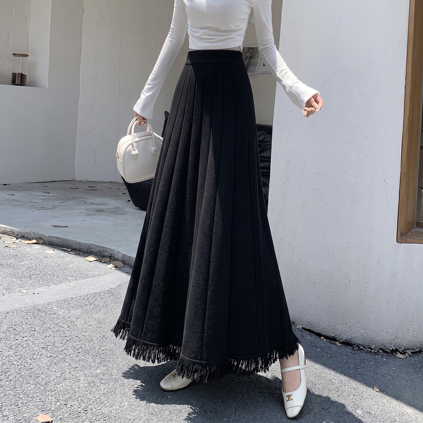 Women's Knit Pleated High Waist A-Line Maxi Skirt with Tassel Detail - Image 4